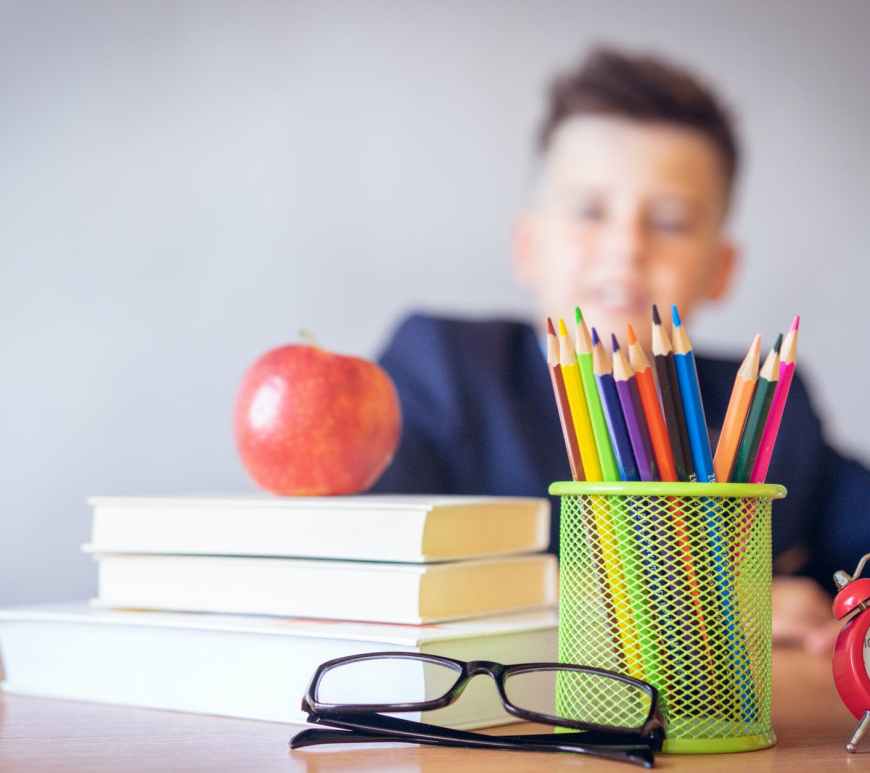 boy looking on a tidied desk